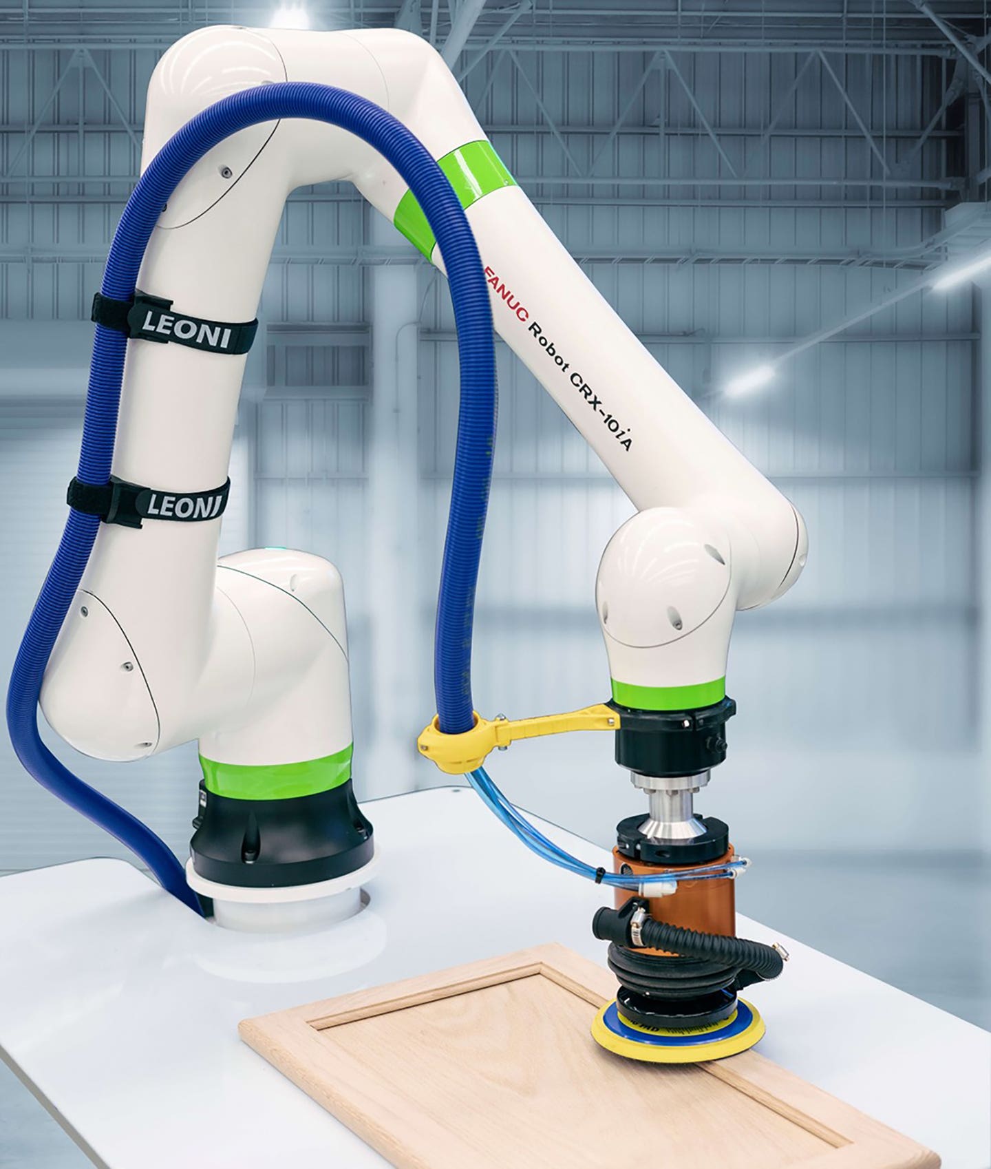 fanucs-crx-10ia-cobot-offers-simple-programming-with-a-drag-and-drop-interface-that-trains-it-to-do-tasks-such-as-sanding-and-coating-parts.jpg